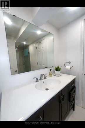 Toronto (Wexford-Maryvale) apartment for rent - A bathroom with a white sink and a mirror.