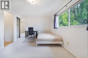 Vancouver apartment for rent - A bedroom with a bed, desk, and chair.
