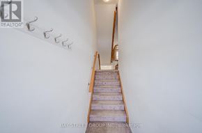 Oshawa (Windfields) townhouse for rent - A staircase with a railing on the left side.