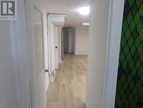 Toronto (Pleasant View) apartment for rent - A hallway with white walls and a wooden floor.