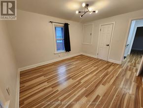Windsor apartment for rent - A room with wooden flooring and white walls.