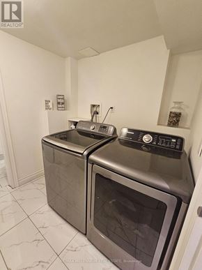 Toronto (Mount Olive-Silverstone-Jamestown) apartment for rent - A kitchen with two ovens and a microwave.