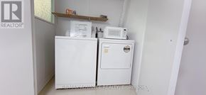 Toronto (Parkwoods-Donalda) apartment for rent - A white fridge and freezer in a small room.