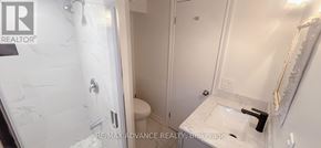 Toronto (Parkwoods-Donalda) apartment for rent - A white bathroom with a marble shower and toilet.