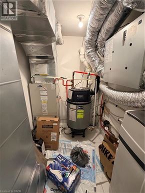 Kitchener townhouse for rent - A room with a lot of boxes and a HVAC unit.