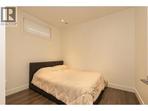 Burnaby apartment for rent - A bedroom with a bed and a window.