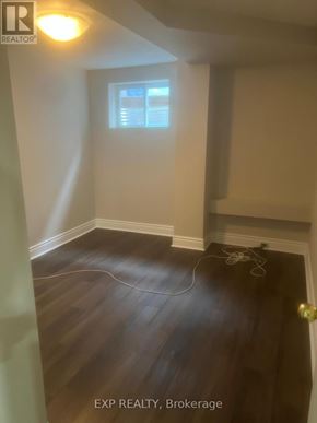 Ajax (Central West) apartment for rent - A room with a window and wooden flooring.