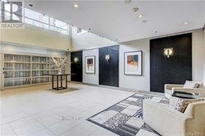 Markham (Unionville) condo for rent - A living room with a couch, a table, and a painting on the wall.