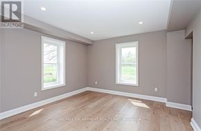 Norfolk (Townsend) apartment for rent - A room with two windows and wooden flooring.