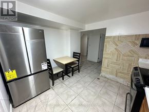 Markham (Middlefield) apartment for rent - A kitchen with a refrigerator, table and chairs.