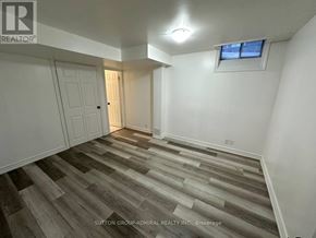 Markham (Middlefield) apartment for rent - A room with wooden flooring and a window with a white frame.