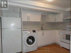 Toronto (L'amoreaux) apartment for rent - A white kitchen with a washing machine and a refrigerator.