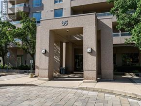 Toronto (Willowdale East) condo for rent - The entrance to apartment building number 357 is framed by two large columns.
