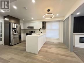 Toronto (Milliken) apartment for rent - A modern kitchen with a refrigerator, stove, and oven.