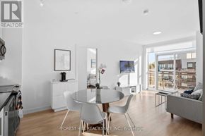 Innisfil condo for rent - A modern dining room with a glass table and white chairs.