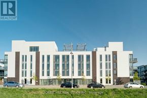 Innisfil condo for rent - A modern building with the logo REALTOR on the top left corner.