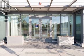 Innisfil condo for rent - The image shows the front of a real estate office with glass doors and a sign that reads "FOREST HILL REAL ESTATE INC.".