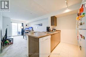 Toronto (Eglinton East) condo for rent - A kitchen with a refrigerator covered in magnets.