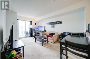 Toronto (Eglinton East) condo for rent - A living room with a couch, chair, and television.