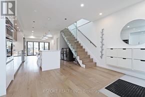 Toronto (Danforth Village-East York) apartment for rent - A spacious, modern kitchen with a staircase leading to the upper floor.