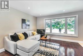 Richmond Hill (Crosby) apartment for rent - A living room with a grey couch and a small table.