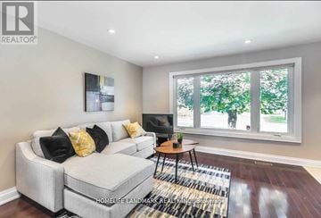Richmond Hill (Crosby) apartment for rent - A living room with a grey couch and a small table.