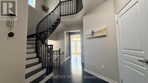 Shelburne apartment for rent - A hallway with a staircase and a door on the right.