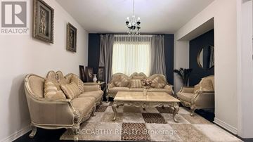 Shelburne apartment for rent - A living room with a beige sofa and a coffee table.
