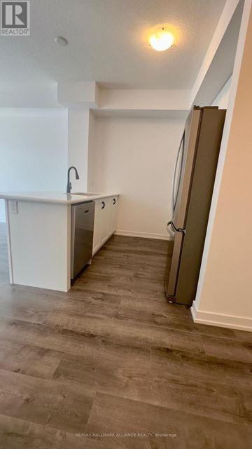 Hamilton (Waterdown) condo for rent - A kitchen with a sink and a refrigerator.