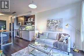 Toronto (Willowdale East) condo for rent - A living room with a couch, a coffee table, and a lamp.