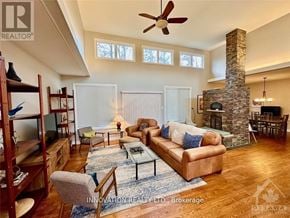 Ottawa apartment for rent - A living room with a stone fireplace and a brown couch.