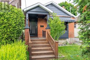 Toronto (Birchcliffe-Cliffside) apartment for rent - A small house with a front porch and stairs leading up to the door.