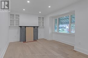 Toronto (Birchcliffe-Cliffside) apartment for rent - A room with a window and a wooden floor.