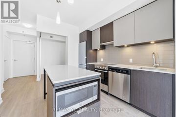 Toronto (Kensington-Chinatown) condo for rent - A modern kitchen with a stainless steel dishwasher and microwave.
