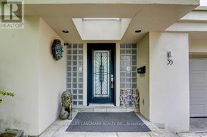 Toronto (Forest Hill South) apartment for rent - A house entrance with a glass door and a stone lion statue.