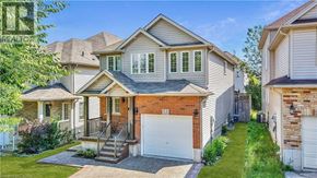 Waterloo apartment for rent - A house with a grey roof and a white garage door.