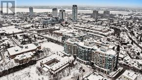 Ottawa condo for rent - A cityscape with buildings and roads covered in snow.