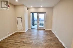 Dutton/Dunwich (Dutton) house for rent - A room with wooden flooring and a door leading outside.