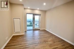 Dutton/Dunwich (Dutton) house for rent - A room with a wooden floor and a sliding glass door leading to a balcony.