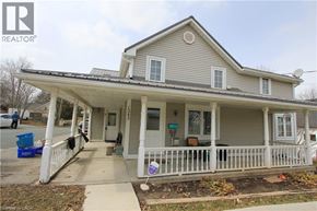 Woolwich apartment for rent - A house with a porch and a sign that says REALTOR.