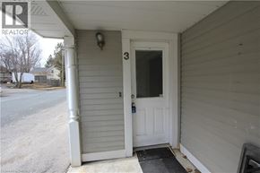 Woolwich apartment for rent - A white door with a black mat in front of it.