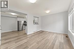 Lakeshore apartment for rent - A room with a vacuum cleaner on the wooden floor.