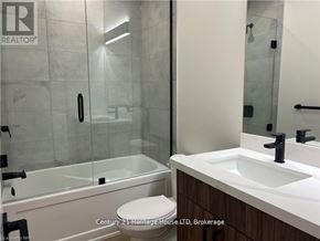 Fort Erie (Central) apartment for rent - A bathroom with a sink, toilet and shower.