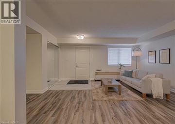 Cambridge condo for rent - A living room with a couch, coffee table, and pictures on the wall.