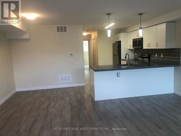Cambridge townhouse for rent - A kitchen with a counter and cabinets.