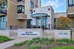 Markham (Unionville) condo for rent - The image shows a building with the sign "131 & 151 Upper Duke Crescent" in front of it.