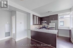 Markham (Unionville) condo for rent - A kitchen with brown countertops and stainless steel appliances.
