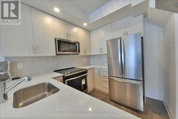 Mississauga (Erin Mills) townhouse for rent - A kitchen with a stainless steel refrigerator and microwave above the sink.