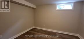 Kitchener apartment for rent - A room with a window and wooden flooring.