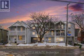 Ottawa multi-family for rent - A house with a sign that says "REALTOR" in front of it.